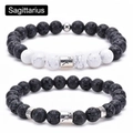 Detail of Sagittarius charm beads with black lava stone and white marble turquoise - Sagittarius