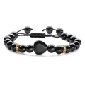 Detail of adjustable black beaded bracelet featuring a heart charm and gold pavé spacers - Faux Black Agate (Woven)