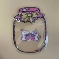 Detail of jar-shaped clear plastic bag with pink star lid and cute white rabbits design - 13*17cm / Pink