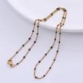 Golden O-chain necklace with elegant black enamel bead accents and lobster clasp - Gold - Black Beads