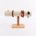 Macro detail of T-bar jewelry display stand with beige velvet and solid wood base - Large Cylinder: Beige Leather