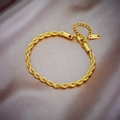 Detail of gold-plated stainless steel rope chain bracelet with lobster clasp on silk - Bracelet