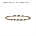Close-up of a two-tone stretch bracelet with 4mm silver and gold beads on white background - Mixed Gold Silver 4mm