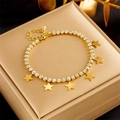Elegante bracciale tennis stella dorato con ciondoli in zirconi su scatola regalo - Bracciale