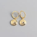 Detail view of golden S925 silver hoop earrings with evil eye charms and zircons - 925 Silver / Gold Color (Pair)