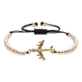 Detail of colorful zircon airplane charm on adjustable black braided rope bracelet - Plane Gold