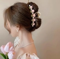 Pink enamel tulip shark clip with faux pearls in gold finish shown on model hair - Light Pink Tulip-YZAP45-24