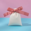 Beige velvet drawstring gift pouch with pink ribbon bow on pastel background - Off-white Red Bean Paste Vermicelli Strip; 10*12