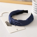 Retro deep blue satin wide headband with knotted design on a minimalist wooden background - Navy Blue