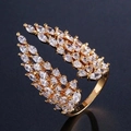 Detailed close-up of adjustable golden wing ring featuring marquise-cut zircon stones - Adjustable Open / Gold