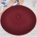 Flat lay view of a wine red wool beret on white lace texture for autumn and winter - 52-54cm / Burgundy
