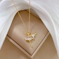 Detail of a golden ballet dancer pendant with sparkling crystals on silk background - Ballet Girl Style (F405)