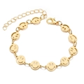 Gold-plated bracelet featuring multiple smiling face charms with adjustable lobster clasp - Smiley Face Chain