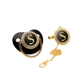 Detail of black and gold baby pacifier with letter S and sparkling rhinestone clip - Letter S
