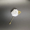 Detail of white fabric rose boutonniere with golden hollow leaf and long metal pin - Pure White
