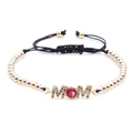 Macro shot of tricolor beaded bracelet with MOM lettering and a red zircon stone - MOM Theme Letter