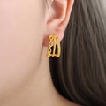 Triple-layered C-shaped gold hoop earrings featuring twisted rope and beaded textures - Gold