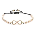 Detailed view of infinity symbol charm with colorful stones on braided bracelet - B0015 Multicolor Zirconia 2