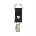 Macro view of black pebble leather hat clip with silver metal ring and grip for travel - Black