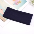 Detail of dark blue ribbed knit headband texture with decorative magazine and dried flowers - Navy Blue