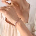 Bracciale elastico in titanio placcato oro 18K con cristalli di zircone rosa brillanti - Oro Zirconia Rosa