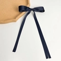 Detail view of smooth navy blue satin ribbon bow with elegant long trailing streamers - Long Streamer Style (Single) / Navy Blue