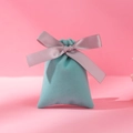 Mint green velvet jewelry pouch with a purple satin ribbon bow on pink background - 6*13cm / Green With Grey Ribbon