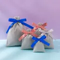 Velvet drawstring jewelry pouches in light grey with assorted colored ribbon bow ties - Gray; 10*12