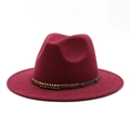 Detail of burgundy wool fedora hat featuring brown leather band with gold rivets - Burgundy