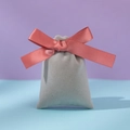 Gray velvet jewelry pouch with pink satin drawstring ribbon on a colorful background - Gray Red Bean Paste Vermicelli Strip; 10*12