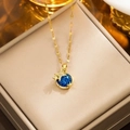 Gold-plated planet necklace with sparkling blue pendant and small star accents - 313 Golden Blue Universe