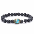 Elastic beaded bracelet with black lava stone, blue gemstone and a vintage gold crown - Lava Stone
