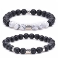 Detail of Virgo zodiac bracelets set with black lava stone and white turquoise beads - Virgo