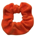 Vibrant orange velvet scrunchie hair tie with soft texture on a clean white background - Orange Yellow