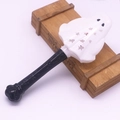Detailed view of a white ghost head wand for Halloween with black textured handle grip - Ghost Magic Wand