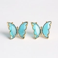 Detail of blue glass butterfly earrings with gold plating and sparkling zircon accents - Aquamarine