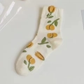 Women's crew socks with yellow tulip floral pattern and green leaves on white cotton base - White