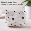 Mini cream canvas coin purse featuring black star patterns and zipper pull with gold clip - Pentagram