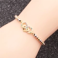 Pulsera de corazón con circonitas de colores y cuentas metálicas tricolores en cuerda negra - Amor Infinito 1