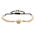 Close-up of crown pendant with micro-pave zircons on multi-tone beaded woven bracelet - Crown Style 2