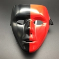 Detailed view of bicolor black and red glossy mask with elastic band for Halloween costume - Red & Black