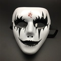 Detail showing hand-painted black eye patterns and red flame totem on white full face mask - Flame Pattern Style