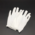 Detailed view of the soft white cotton fabric and texture of the ceremonial gloves - Gloves
