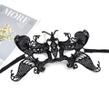 Detail of a black lace butterfly mask with satin ribbons on a minimalist white backdrop - 029 Large Butterfly