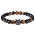 Macro detail of 8mm tiger eye beads and metal wolf head with green cubic zirconia eyes - Tiger's Eye