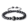 Detail of black onyx beaded bracelet with metal lion head charm and adjustable braided cord - Black Agate Bracelet