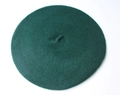 Detailed top view of dark green wool beret featuring subtle knitted texture and small stem - 52-54cm / Army Green