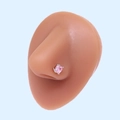Detailed view of a pink heart zircon nose stud with wing design on a silicone model - Silver Winged Pink Heart (#27)