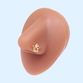 L-shaped gold nose stud with double star design and clear zircon on a silicone model - Gold Star White Zirconia (#25)