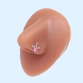 Macro shot of L-shaped nose stud with pink heart zircon and silver wings on model - Silver Pink Heart Cupid's Arrow (#28)